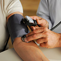 A patient having her blood pressure taken. A patient having her blood pressure taken.