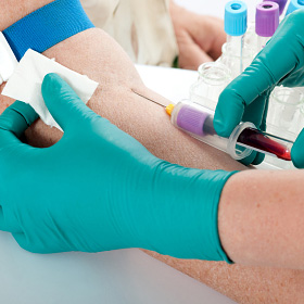 A patient having a blood sample collected.
