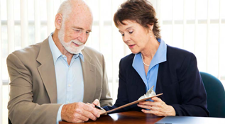 Two people reviewing estate planning documents